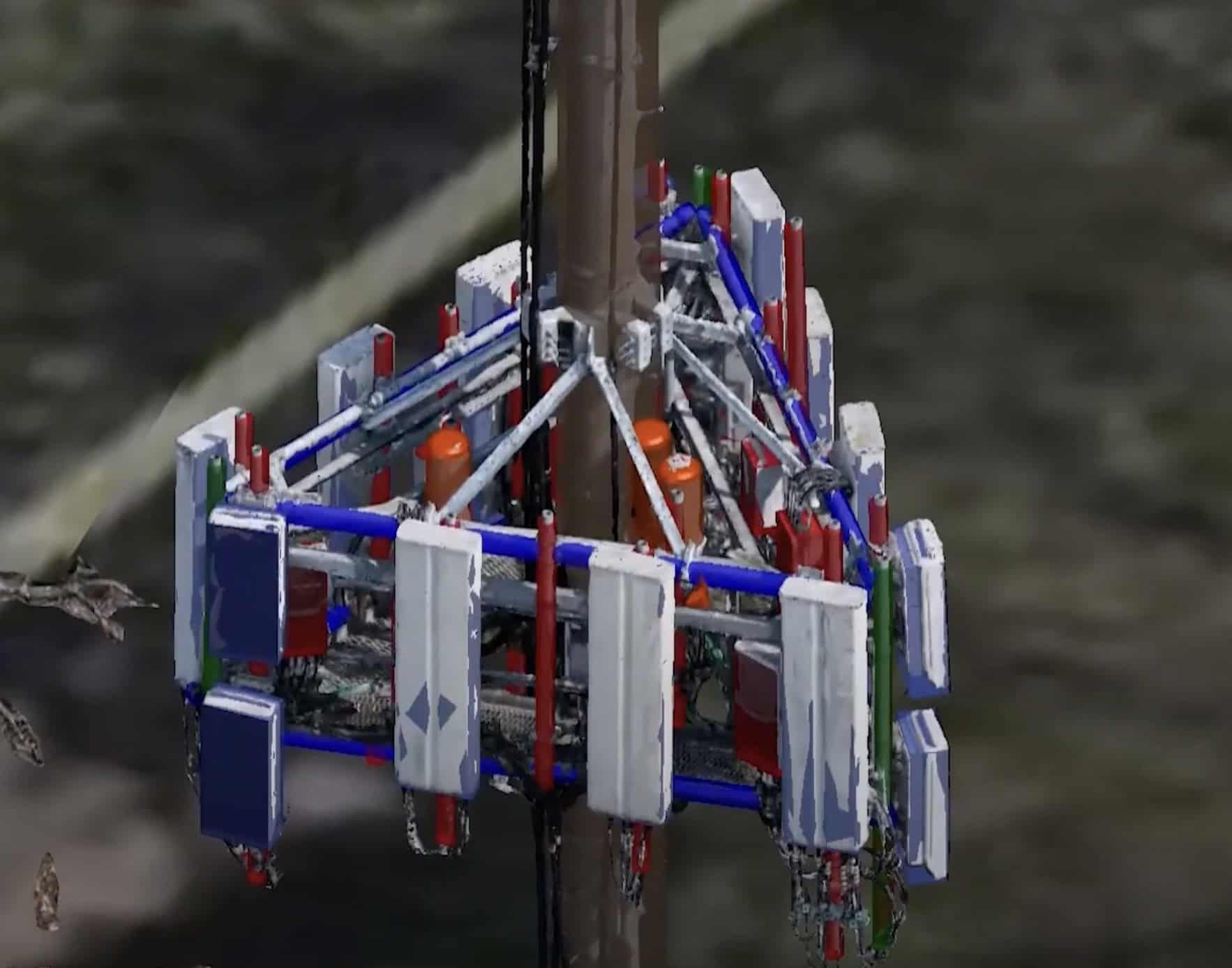 A complex assembly of antennas and equipment is mounted on a pole, featuring multiple panels and colored components, all optimized for seamless 5G connectivity.